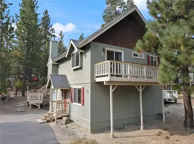 a house with a porch and a balcony at 3BR Home w Game Room by The Village, Lake & Summit in Big Bear Lake