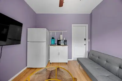 a living room with a couch and a refrigerator at Cozy Backhouse Stay – Sleeps 2 Beverly Hills Adj in Los Angeles
