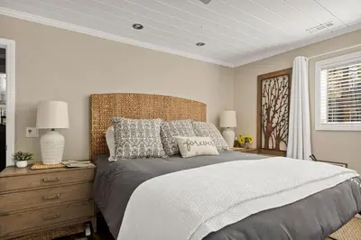 a bedroom with a large bed and a window at Serenity Nook in Big Bear with a Hot Tub in Big Bear Lake