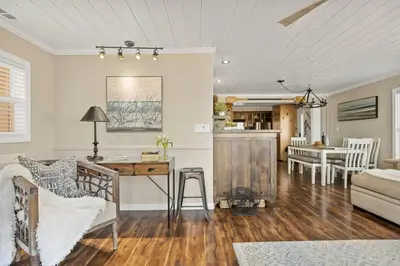 a living room with a desk and a dining room at Serenity Nook in Big Bear with a Hot Tub in Big Bear Lake