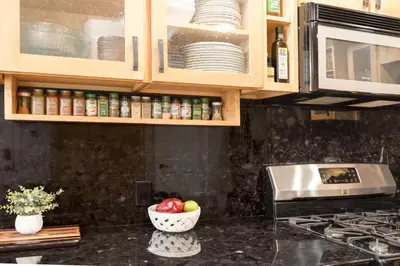 a kitchen with a counter top with a bowl of fruit at Serenity Nook in Big Bear with a Hot Tub in Big Bear Lake