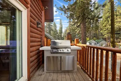 a grill on the deck of a house at Llama Bear Lodge with Hot Tub in Big Bear Lake