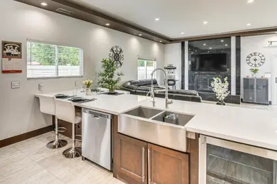 a kitchen with a sink and a counter top at Private Pool and Sauna Pet-Friendly Reseda Retreat! in Reseda