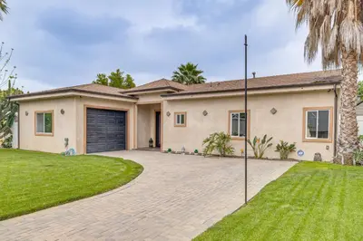 a house with a driveway and a garage at Private Pool and Sauna Pet-Friendly Reseda Retreat! in Reseda