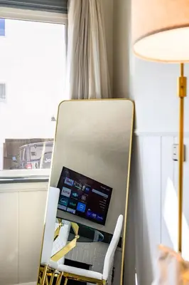 a laptop computer sitting on a chair in a room at 2BR Luxury Getaway Mins to Beach Arcade & Games in Manhattan Beach