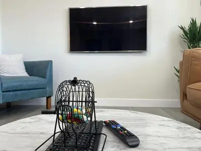 a wire basket sitting on a table next to a remote control at Gated & remodeled 2b2b house 3373 in Baldwin Park