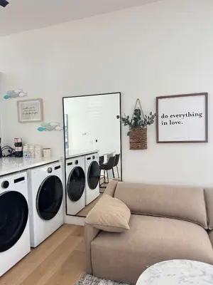 a living room with two washing machines and a couch at #Marbella Lane - Stylish Haven Near City Center in Long Beach