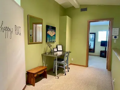 a room with a desk and a table with a mirror at Cozy Guesthouse with Private Pool and Heated Jacuzzi in Santa Clarita