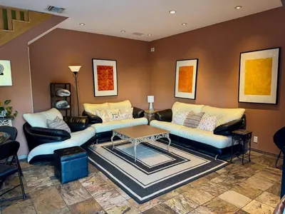 a living room with two couches and a table at Cozy Guesthouse with Private Pool and Heated Jacuzzi in Santa Clarita