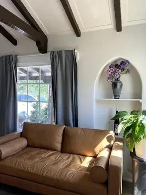 a brown couch in a living room with a window at Fully Remodeled 2B1B Home in Baldwin3369 in Baldwin Park