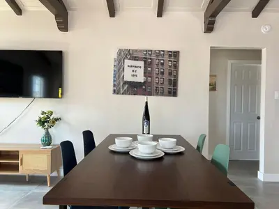 a dining room with a wooden table and chairs at Fully Remodeled 2B1B Home in Baldwin3369 in Baldwin Park