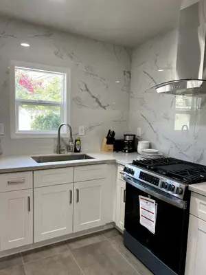 a kitchen with a black stove and a sink at Fully remoded 1B1B Home in baldwin Park3369A in Baldwin Park
