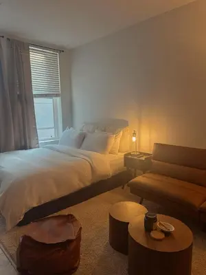a bedroom with a large bed and a couch at Elegant Suite at Marina-Venice Beach with Pool, Jacuzzi, GYM by Holisticā Retreats in Los Angeles