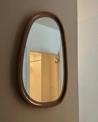 a mirror with a wooden frame hanging on a wall at Elegant Suite at Marina-Venice Beach with Pool, Jacuzzi, GYM by Holisticā Retreats in Los Angeles