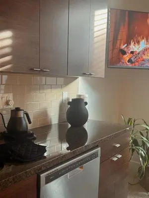 a kitchen with a stove with a vase on the counter at Elegant Suite at Marina-Venice Beach with Pool, Jacuzzi, GYM by Holisticā Retreats in Los Angeles