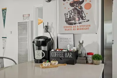 a counter with a coffee bar and a sign on it at Cowboy Cabin with Lake Views in Big Bear Lake