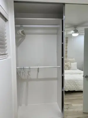 a sliding glass door leading to a bedroom at Manhattan Beach Beachfront Charming On The Strand in Manhattan Beach