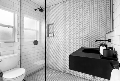 a bathroom with a shower and a toilet and a sink at Bougainvillea Bungalow Peaceful Venice Retreat in Los Angeles