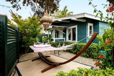 a hammock in the yard of a house at Bougainvillea Bungalow Peaceful Venice Retreat in Los Angeles