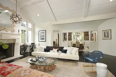 a living room with a couch and a table at Laurel Canyon Classic Hollywood Residence With Pool in Los Angeles
