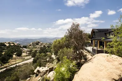 a house on a rock with a view at Retreat to the Rocks Historic Film And Music Getaway in Chatsworth Lake Manor