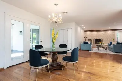 a dining room with a table and chairs at Bella Villa near Beverly Hills Amazing City view and hot tub in Los Angeles