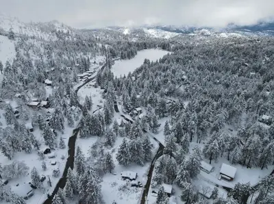 an aerial view of a snow covered forest at The Honey Bear Cabin Jacuzzi EV Friendly Renovated in Green Valley Lake