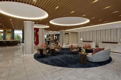 a lobby with couches and tables and chairs at Hilton Arcadia Los Angeles in Arcadia