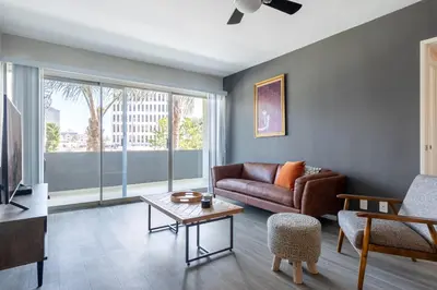 a living room with a couch and a table at Brentwood 2BR w Outdoor Pool nr shops LAX-146 in Los Angeles
