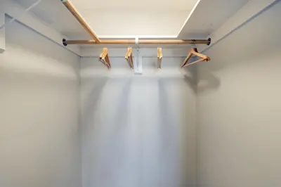 a row of wooden hangers in a room at Brentwood 2BR w Outdoor Pool nr shops LAX-146 in Los Angeles