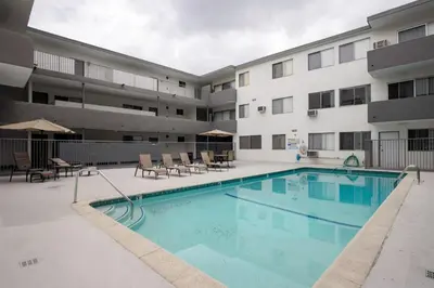 a pool in front of a apartment building at Brentwood 2BR w Outdoor Pool nr shops LAX-146 in Los Angeles