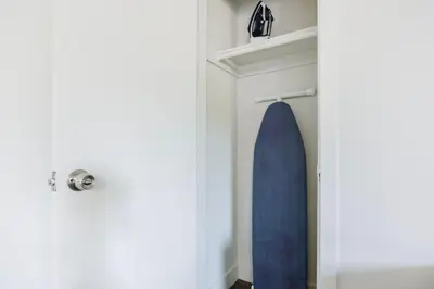a surfboard hanging on a wall next to a door at Blueground Mar Vista nr Venice Beach wd LAX-1327 in Los Angeles