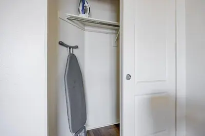 a gray tie hanging on a door in a room at Blueground Venice pool wd nr beach LAX-1329 in Los Angeles