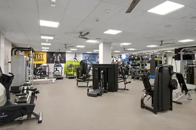 a gym with a lot of exercise equipment in it at Blueground Venice pool wd nr beach LAX-1329 in Los Angeles