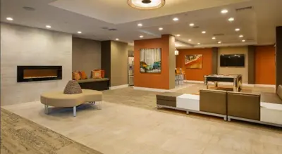 a living room with a couch and a piano at LALAs House- 1br with Free Parking, Pool and Sauna in Los Angeles