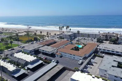 an aerial view of a city and the beach at 4950 Sandyland Road #127 condo in Carpinteria