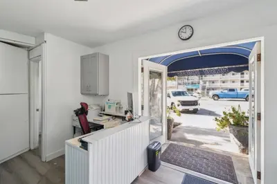 an office with a door open to a yard at 4950 Sandyland Road #127 condo in Carpinteria