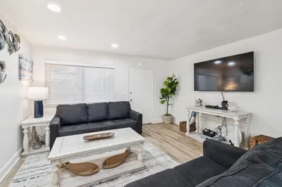 a living room with a couch and a table at 2 Bed Beach Condo #125 in Carpinteria