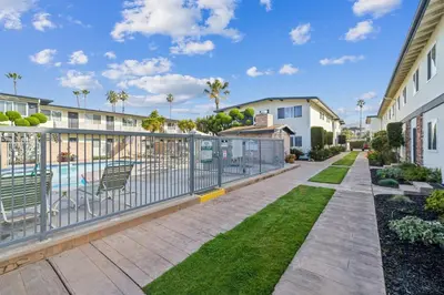 a balcony with a fence and a swimming pool at Beach Condo with Private Ocean View Balcony #237 in Carpinteria
