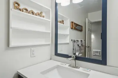 a bathroom with a sink and a mirror at Beach Condo with Private Ocean View Balcony #237 in Carpinteria