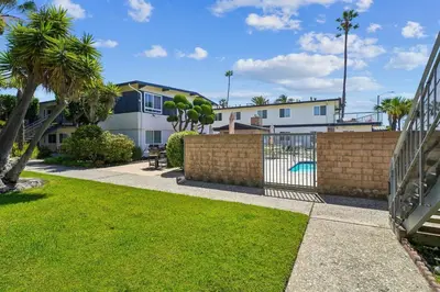 a backyard with a fence and a pool at 1 Bed Beach Condo #131 in Carpinteria