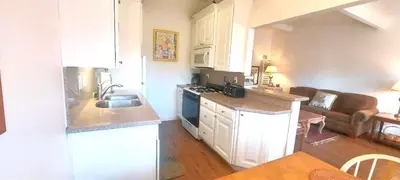 a kitchen with a sink and a stove top oven at Full 1 Bed Beach Condo #227 in Carpinteria