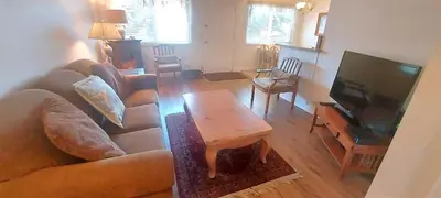 a living room with a couch and a coffee table at Full 1 Bed Beach Condo #227 in Carpinteria