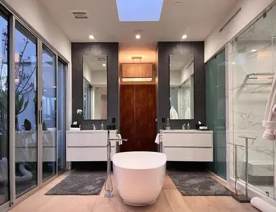 a bathroom with two sinks and a bath tub at Stunning Home - Pool & Hot Tub - Fire Pit in Los Angeles