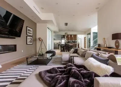a living room with a couch and a table at Stunning Home - Pool & Hot Tub - Fire Pit in Los Angeles