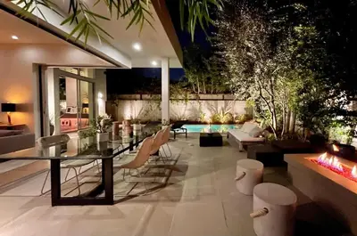 a living room with a glass table and chairs at Stunning Home - Pool & Hot Tub - Fire Pit in Los Angeles