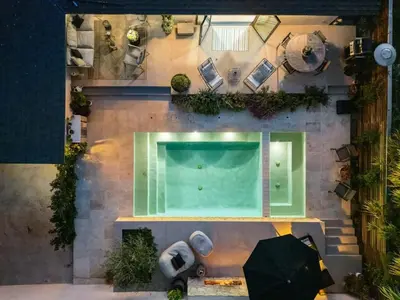 an overhead view of a swimming pool with an umbrella at Hollywood Hills Villa by Universal - Pool - Dogs OK in Los Angeles
