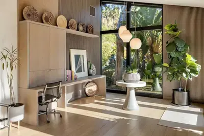 a living room with a desk and chairs and a large window at Hollywood Hills Villa by Universal - Pool - Dogs OK in Los Angeles