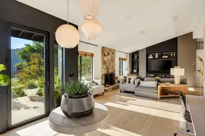 a living room with a couch and a table at Hollywood Hills Villa by Universal - Pool - Dogs OK in Los Angeles