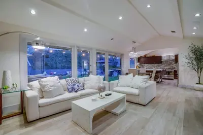 a living room with two white couches and a table at Hollywood Hills Retreat - Private GYM & STEAM ROOM in Los Angeles